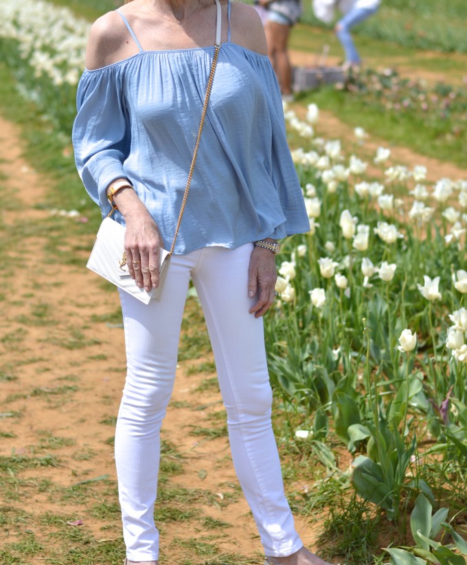 spring flowers, blue off the shoulder top, white jeans