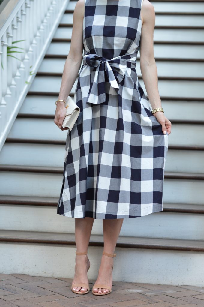 blue and white checked dress, white clutch, dress with a bow