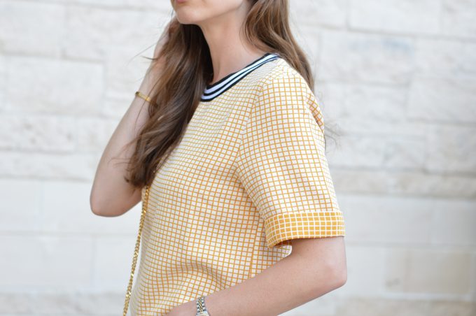 yellow check cross boxy top with black and white banded neck