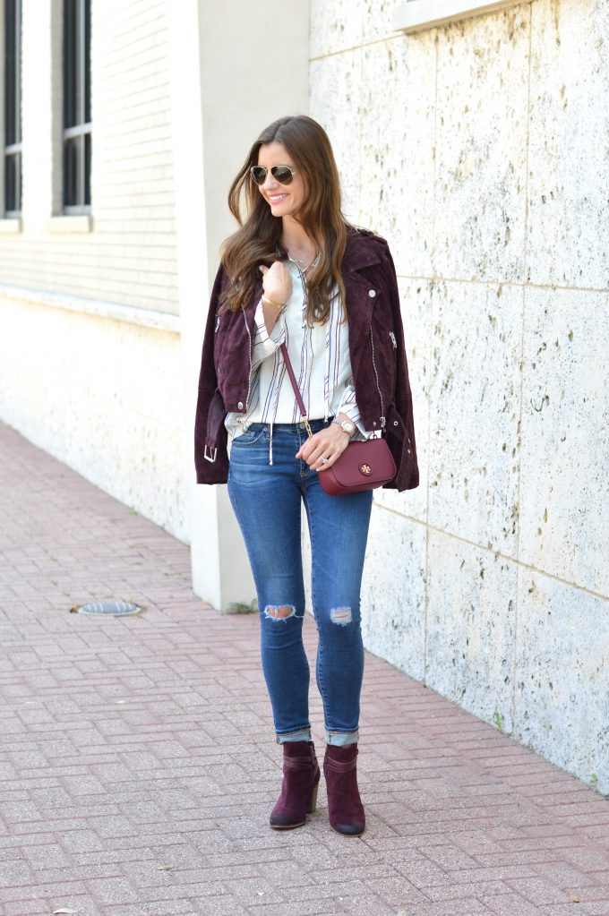 Burgundy suede moto jacket with a small cross body bag in oxblood and burgundy moto booties