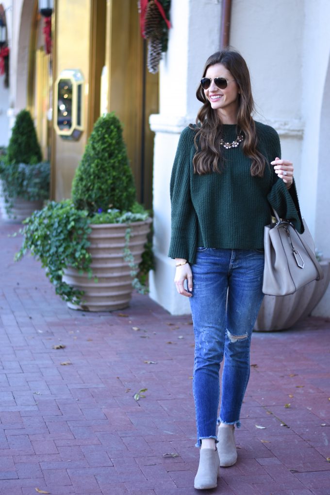 green sweater, distressed jeans, grey handbag, grey booties