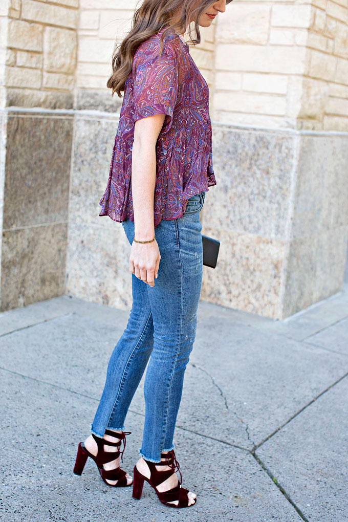 purple paisley top, step hem jeans, burgundy velvet lace up heels