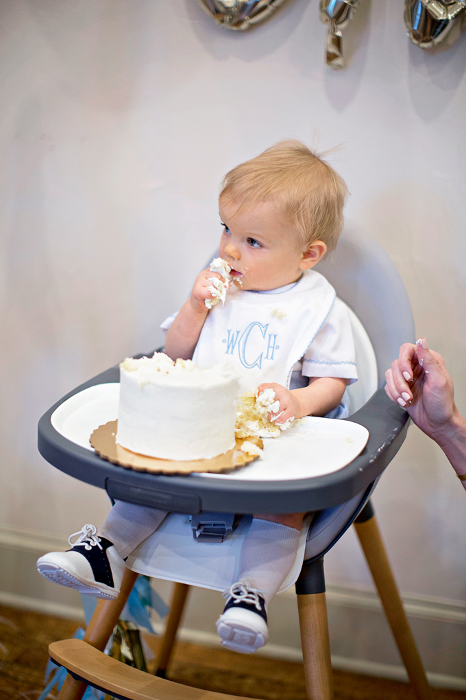 one year old baby eating birthday cake