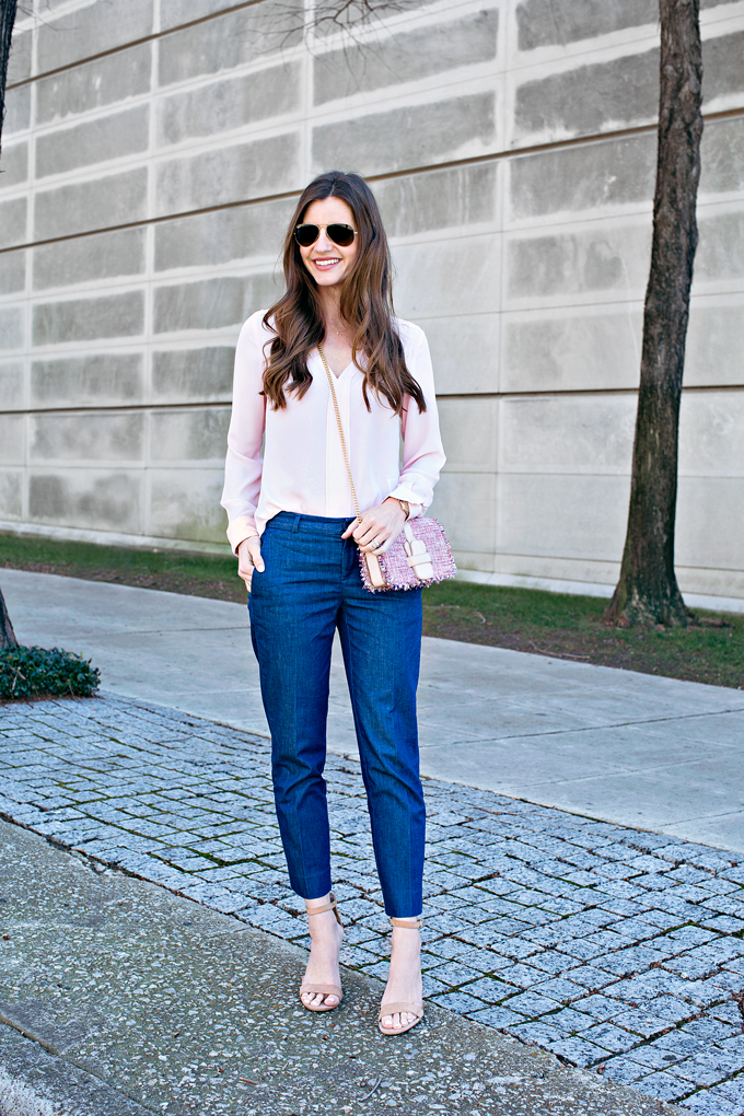 pale pink blouse with tweed cross body bag and denim pants