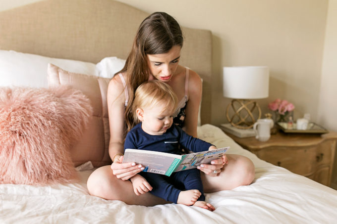 mom and baby readinig in bed