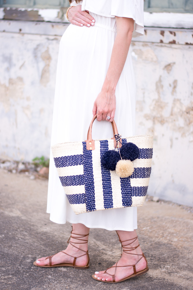 navy and white straw tote bag