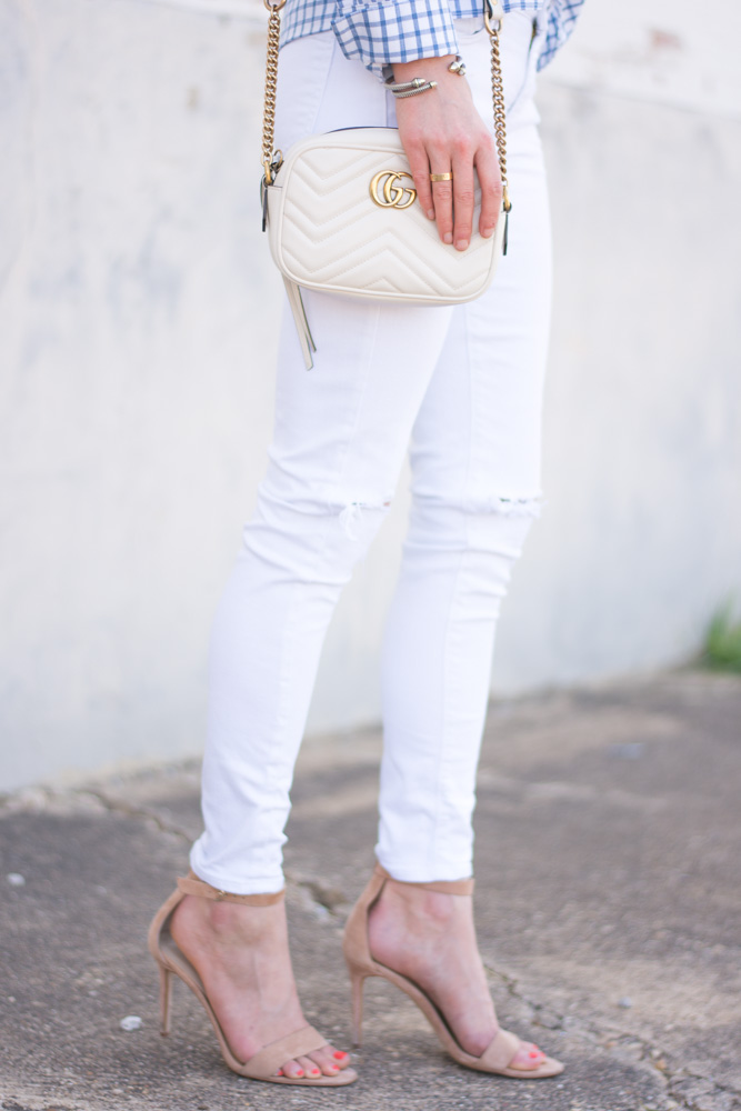 white distressed jeans, white shoulder bag
