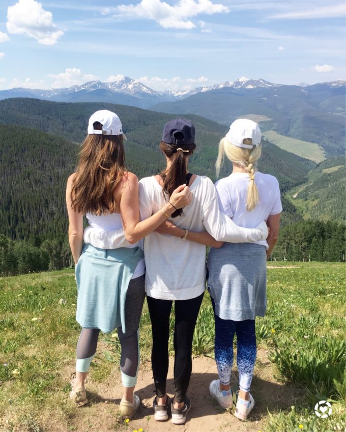 three women with view of vail mountain