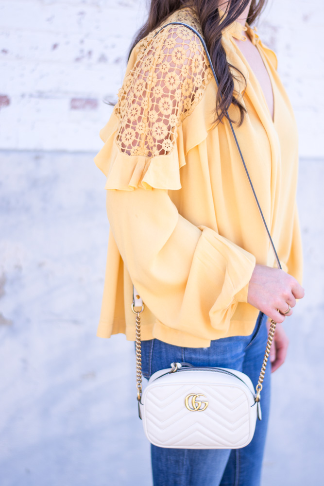 yellow long sleeve top with ruffle and lace details