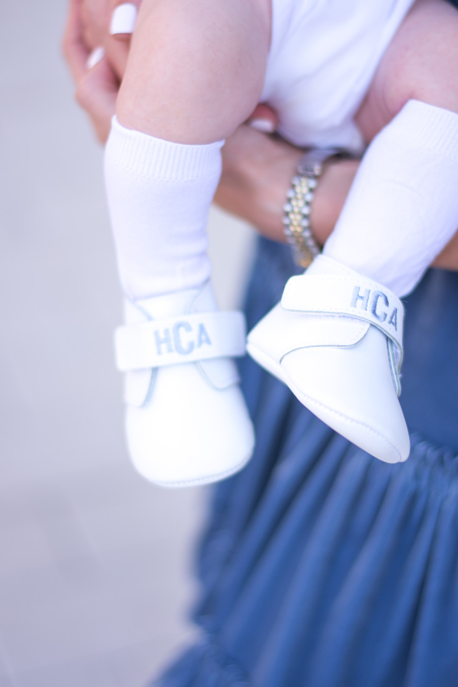 white monogrammed baby shoes
