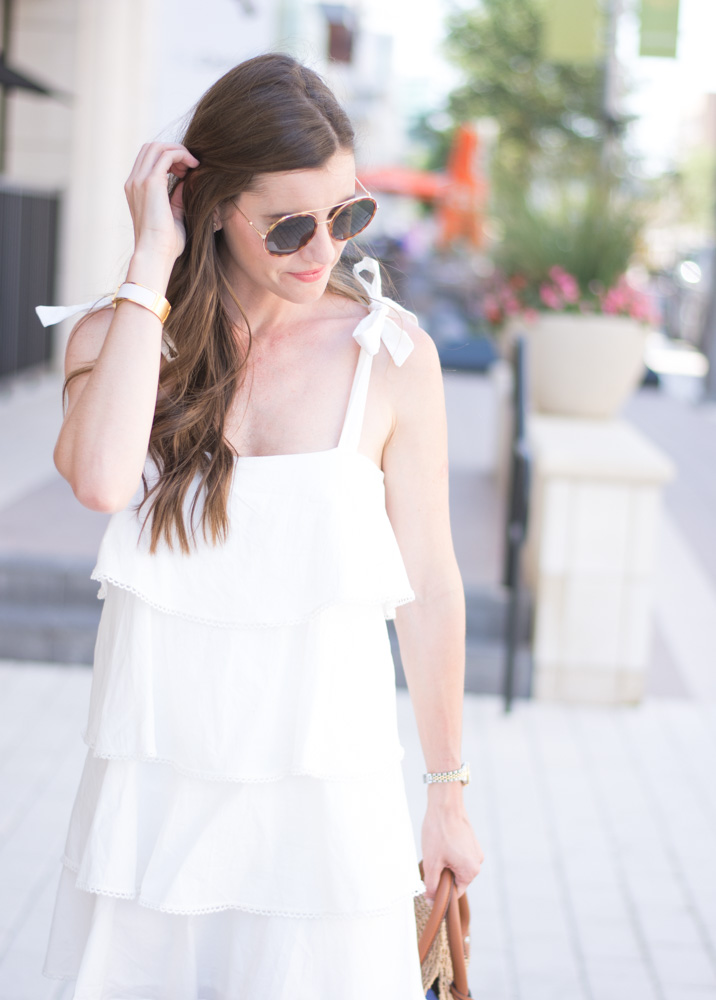 round sunglasses white ruffle dress with tie shoulders