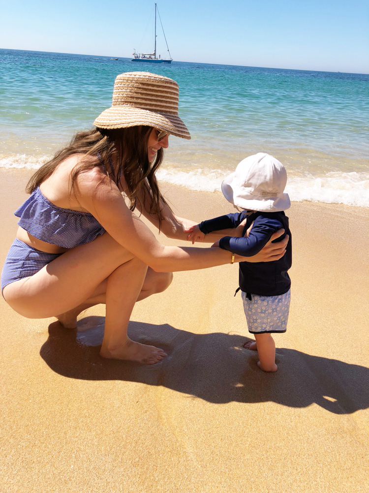 mom and baby boy at the beach in the algarve