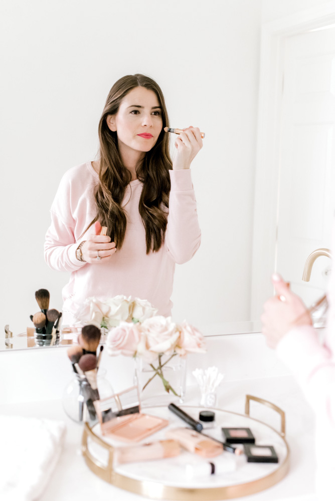 young woman applying makeup five minutes