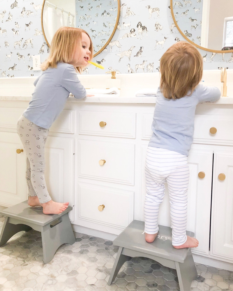 toddler boys brushing teeth at sinks