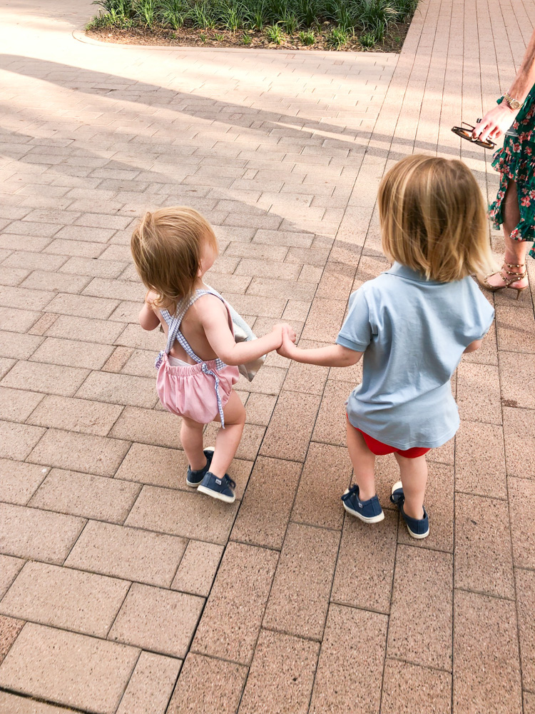 toddler boys holding hands