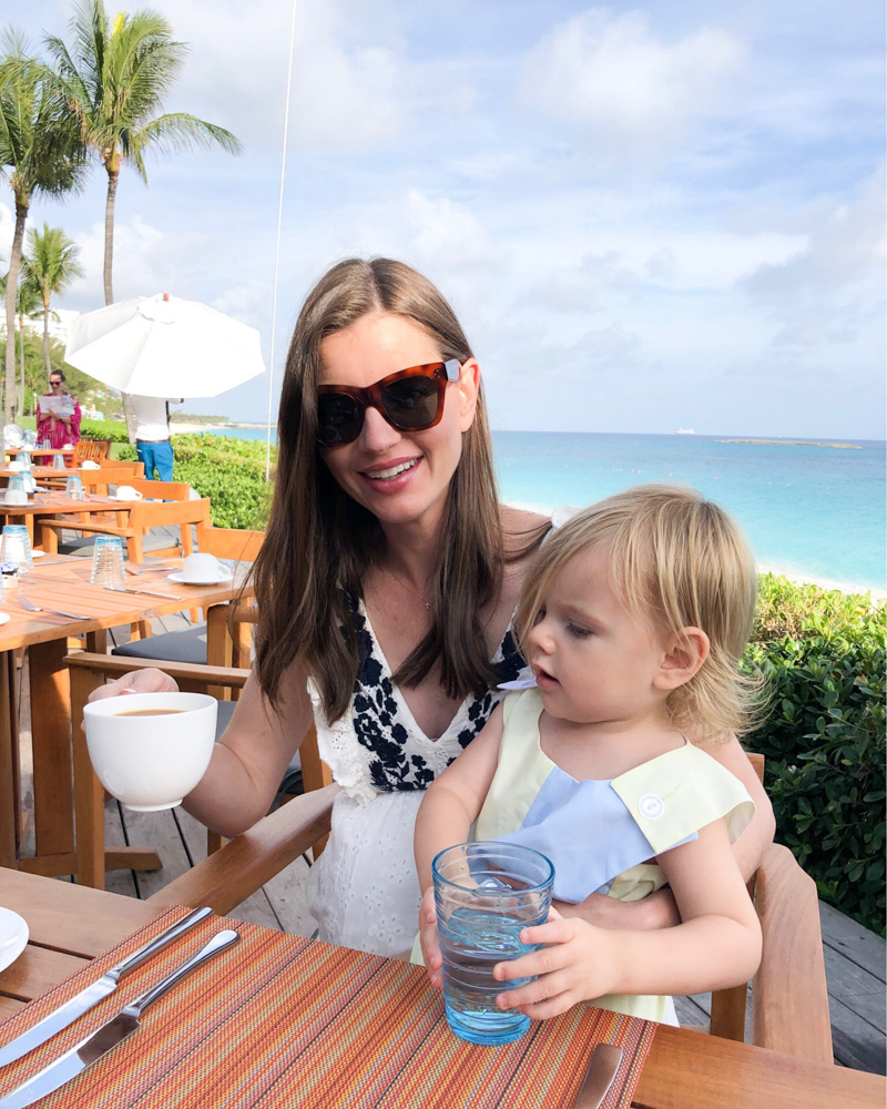 mom and toddler at breakfast overlooking beach