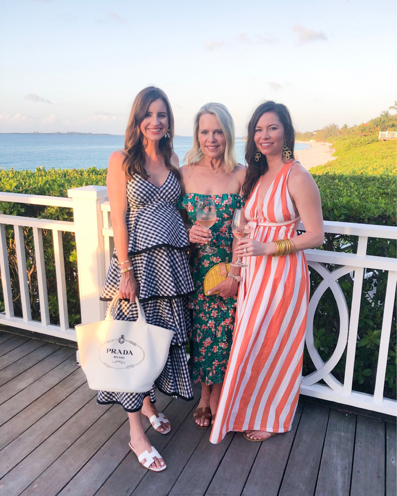 three women wearing maxi dresses overlooking beach