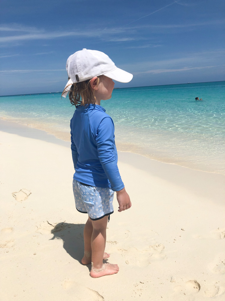 toddler boy looking out to ocean