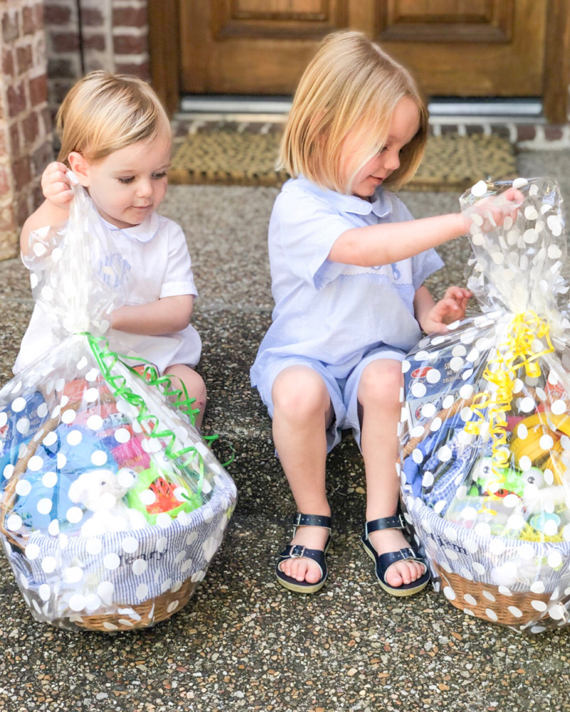 toddler boys opening Easter baskets