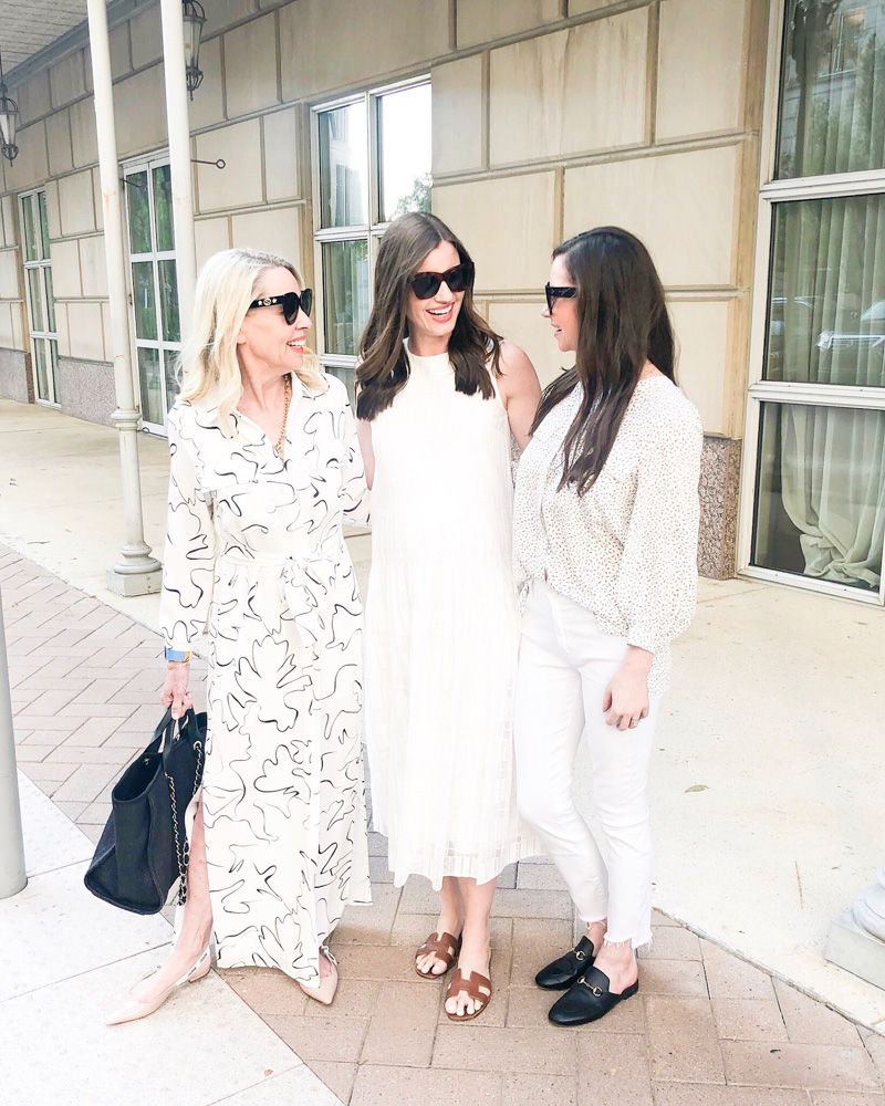 three women laughing together