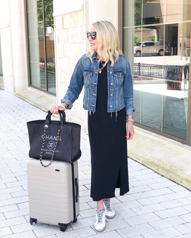 woman with suitcase and tote bag