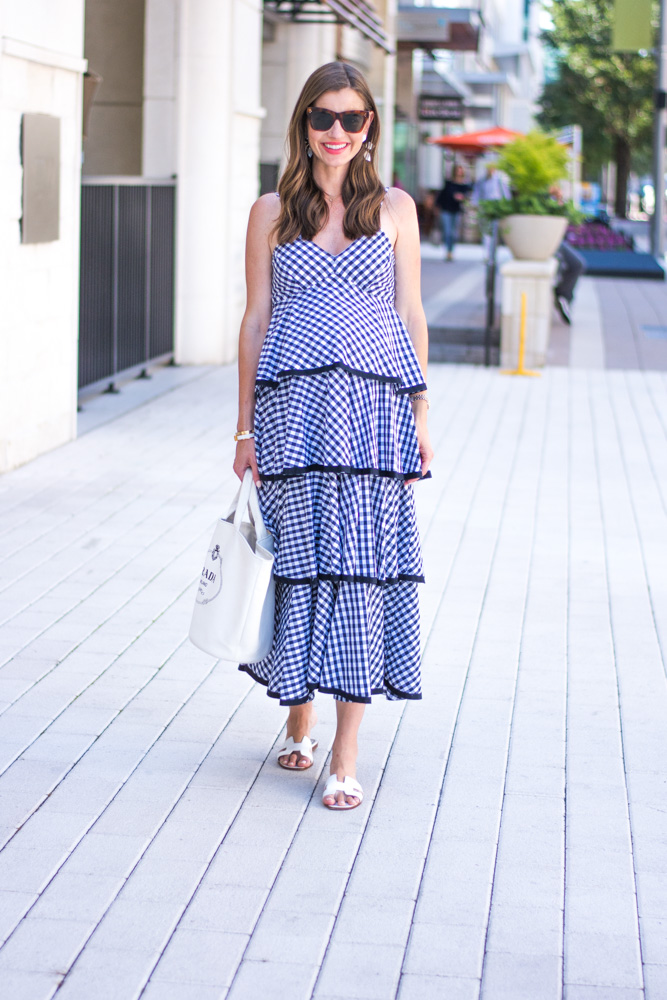 woman walking on street wearing tiered maxi dress