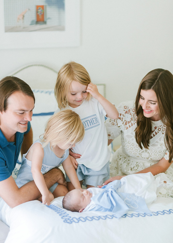 family looking at new baby