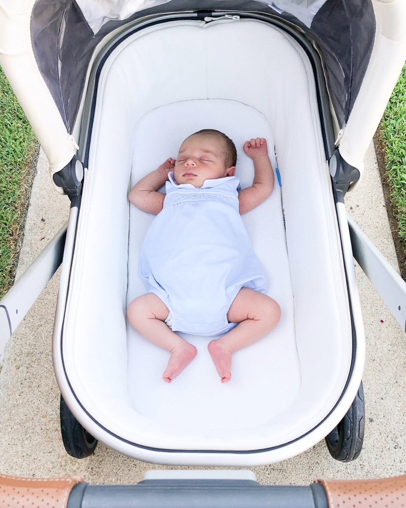 baby boy sleeping in bassinet stroller