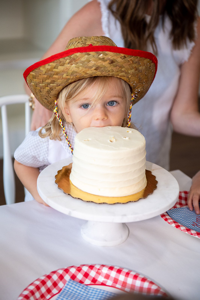 baby boy's second birthday eating cake