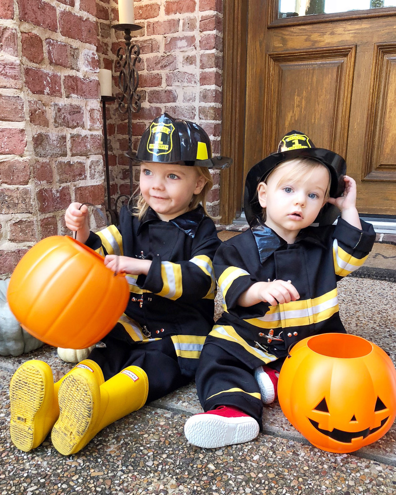 toddler boys in firefighter costumes