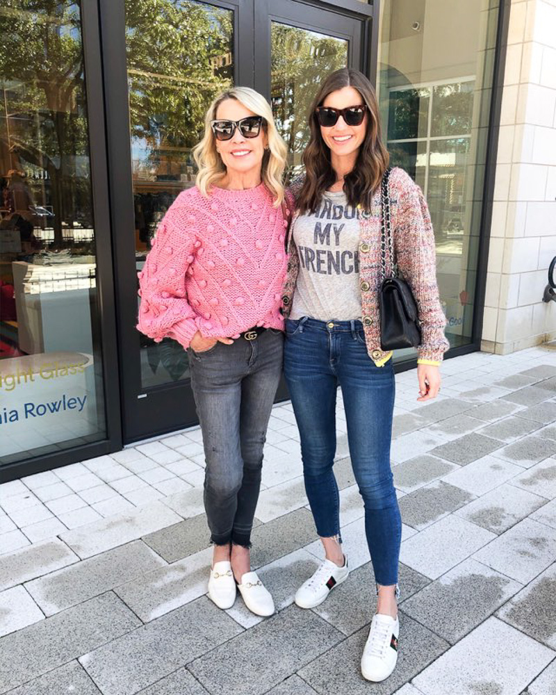 two women in sweaters and jeans