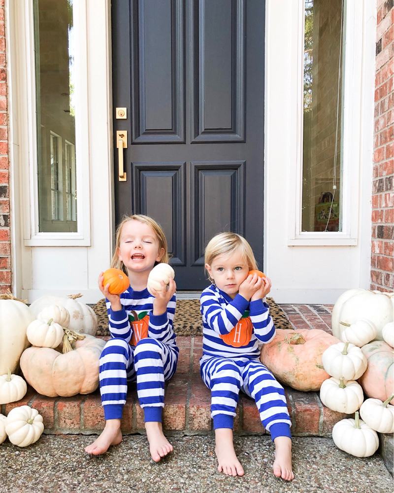 two boys in striped pumpkin pajamas