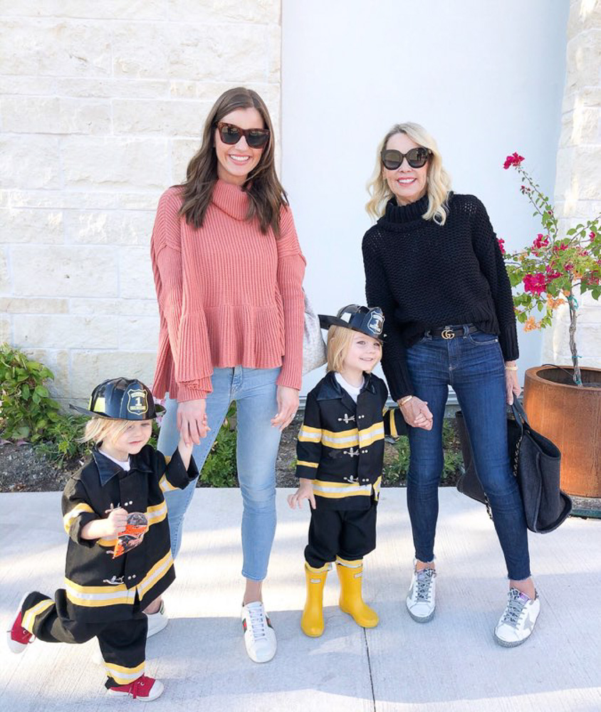 two women with toddlers dressed as fire fighters