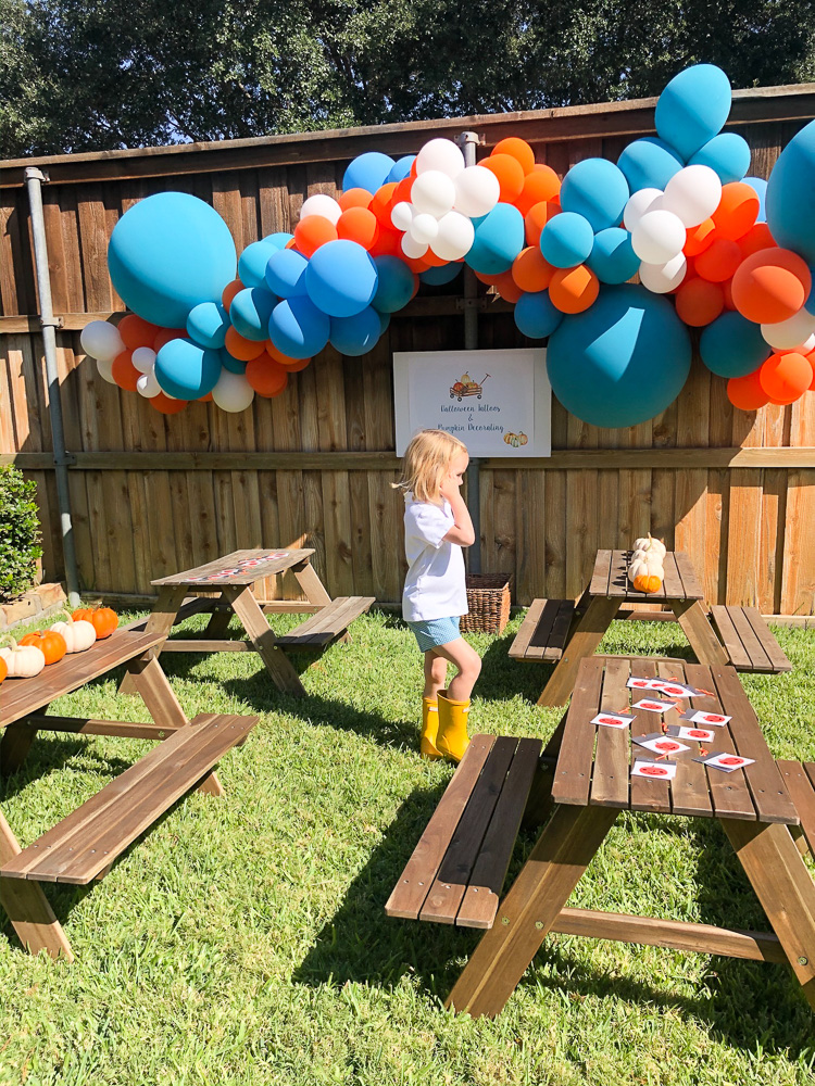 balloons and picnic tables for pumpkin party