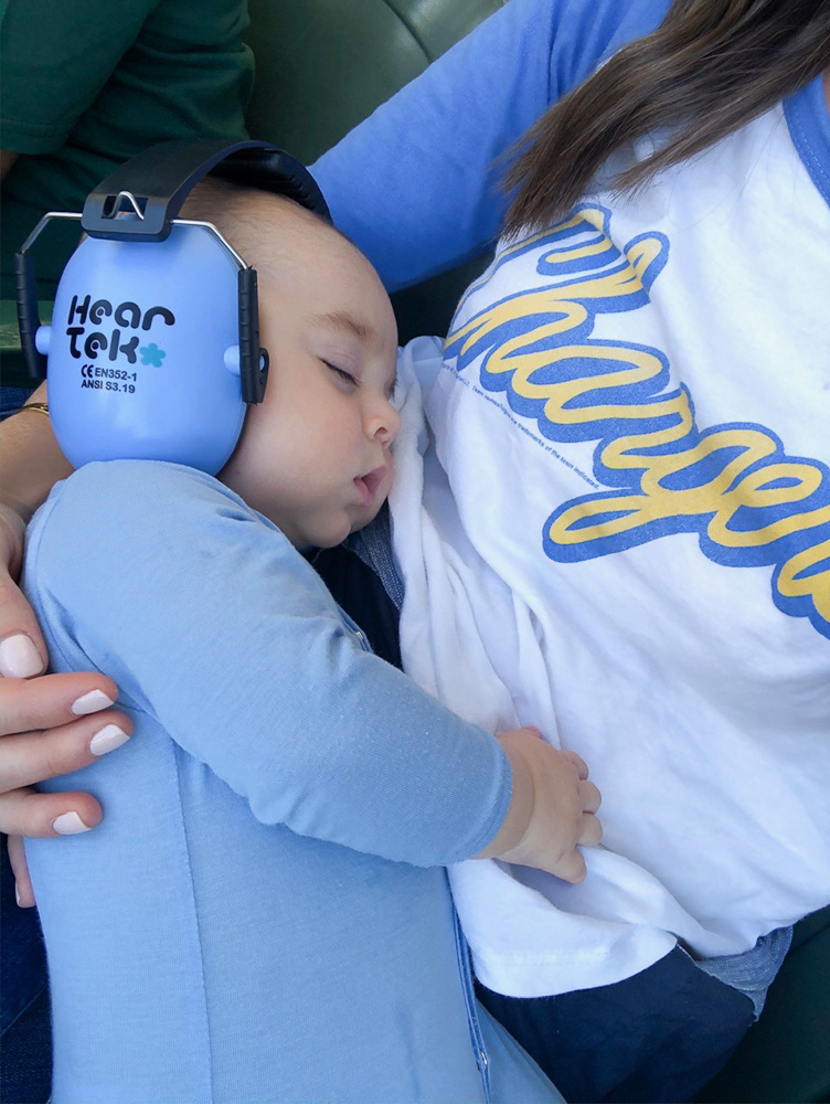 baby boy sleeping at football game