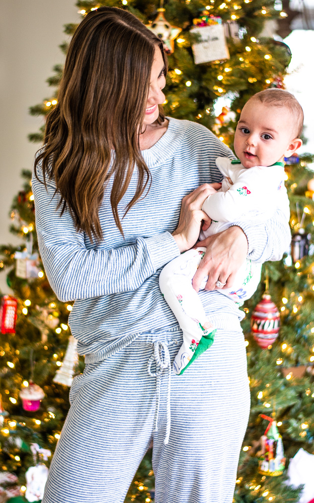 mom holding baby in chirstmas pajamas