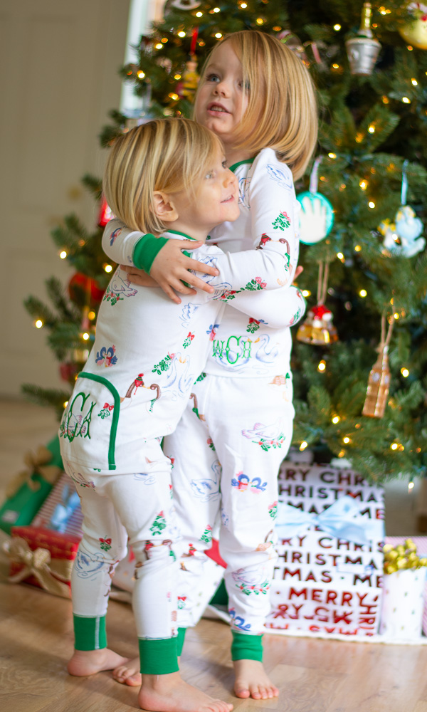 toddler boys hugging in matching pajamas