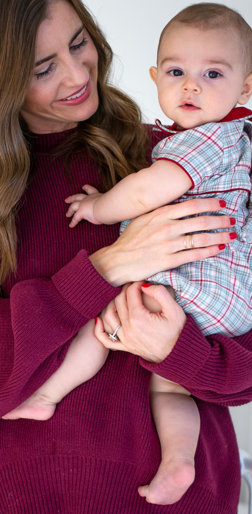 mom holding baby in plaid bubble