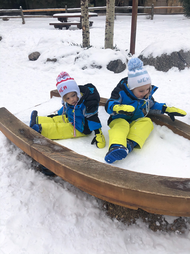 toddler boys playing in the snow