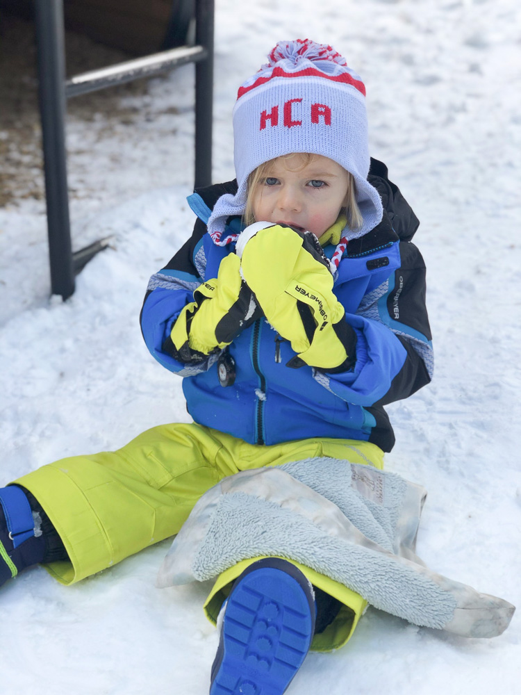 toddler boy in the snow