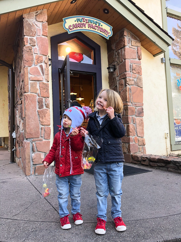 toddler boys outside of candy shop vail