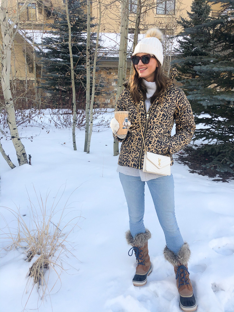 woman drinking iced coffee in the snow