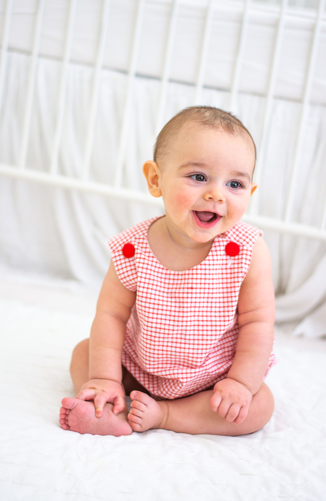 six month old baby sitting up