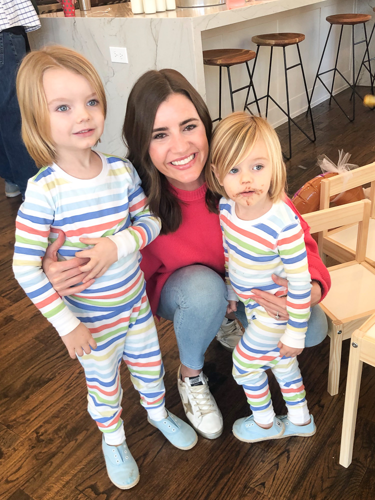 mom with two toddler boys in striped pajamas