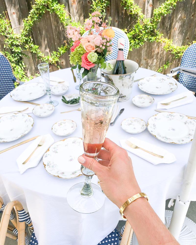 rosé champagne and table set outside