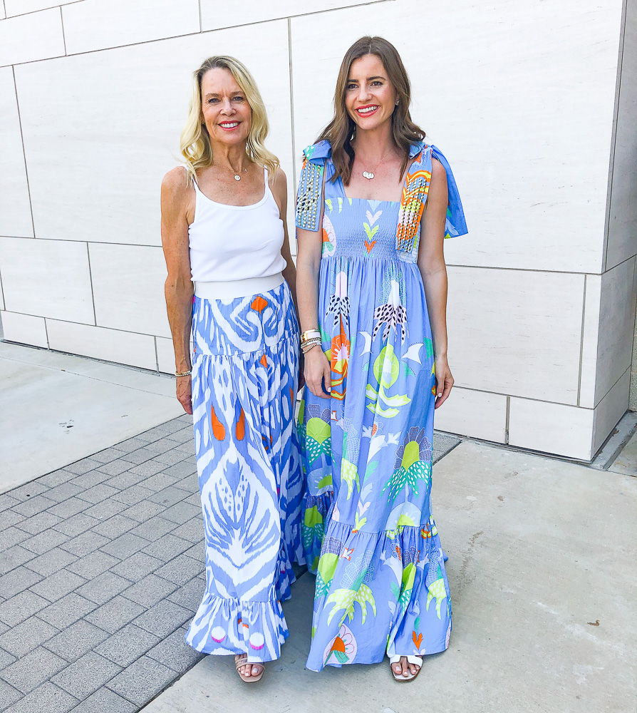 two women in floral maxi dresses