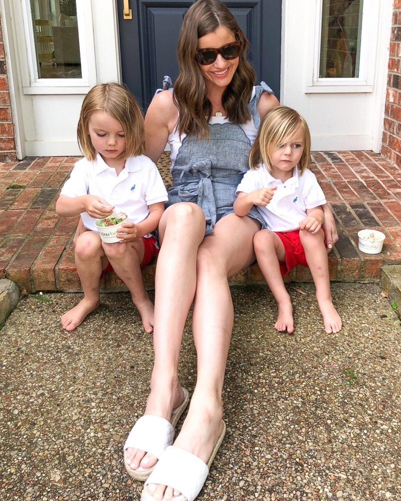 mom sitting on front porch with two boys eating ice cream