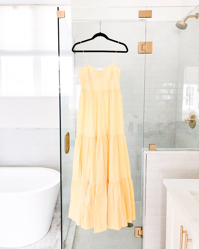 yellow maxi dress hanging on shower