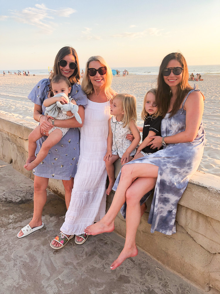 three woman three toddler boys sunset at the beach