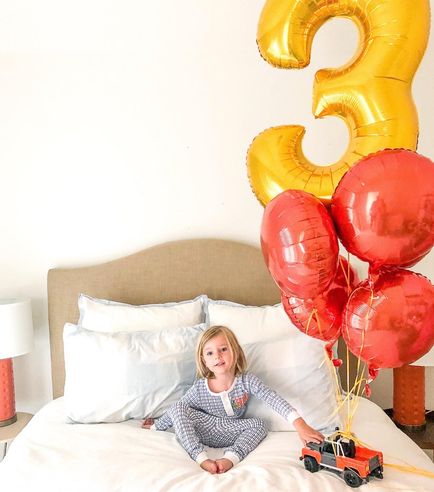 three year old boy with balloons